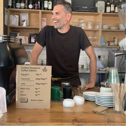 A man at The Hive cafe in London, UK